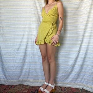 Green-yellow and white polka dot mini wrap dress